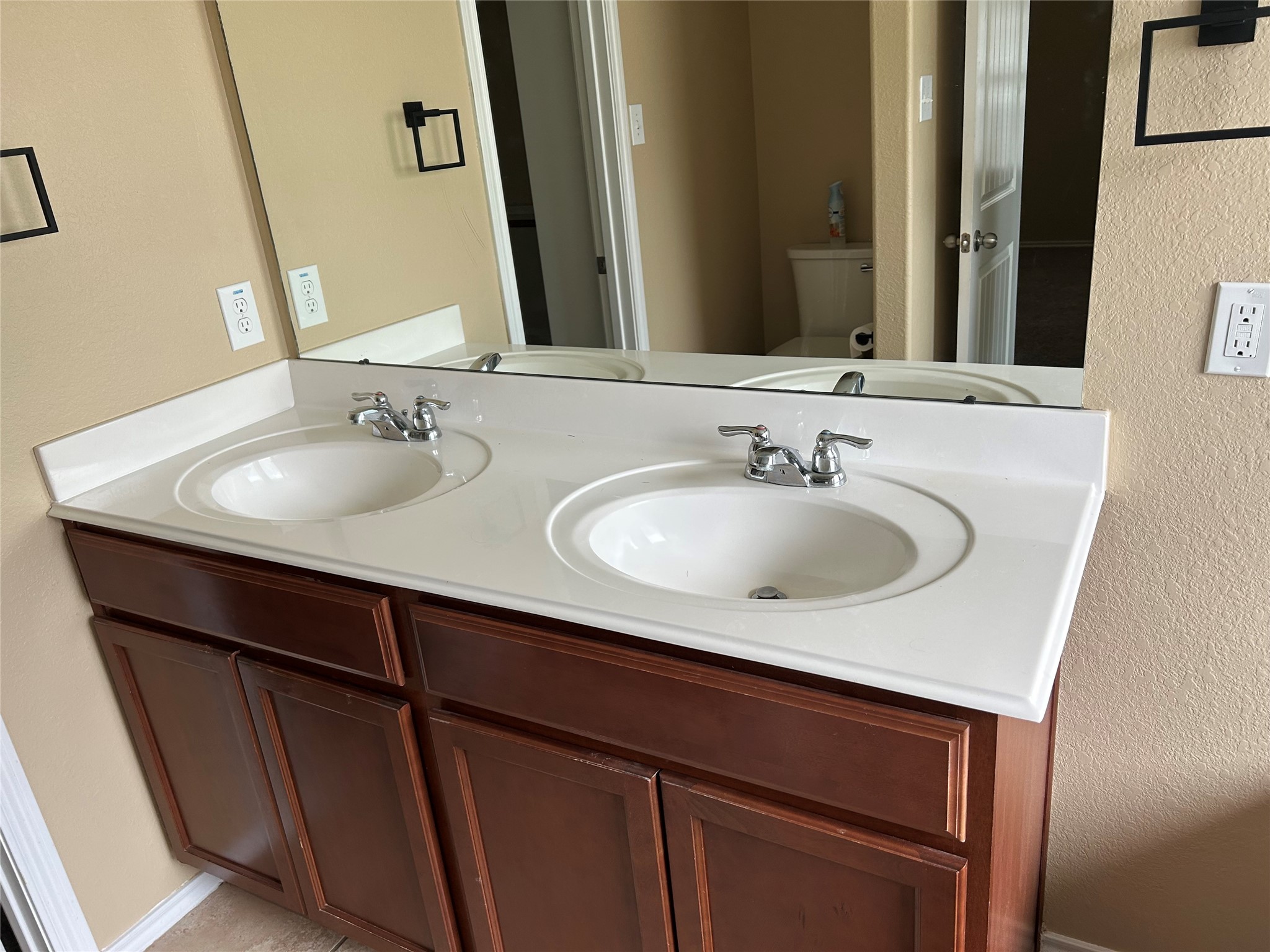 25111 Country Gate Drive Tomball, TX 77375 - Photo 18 of 22 a bathroom with a sink and a mirror