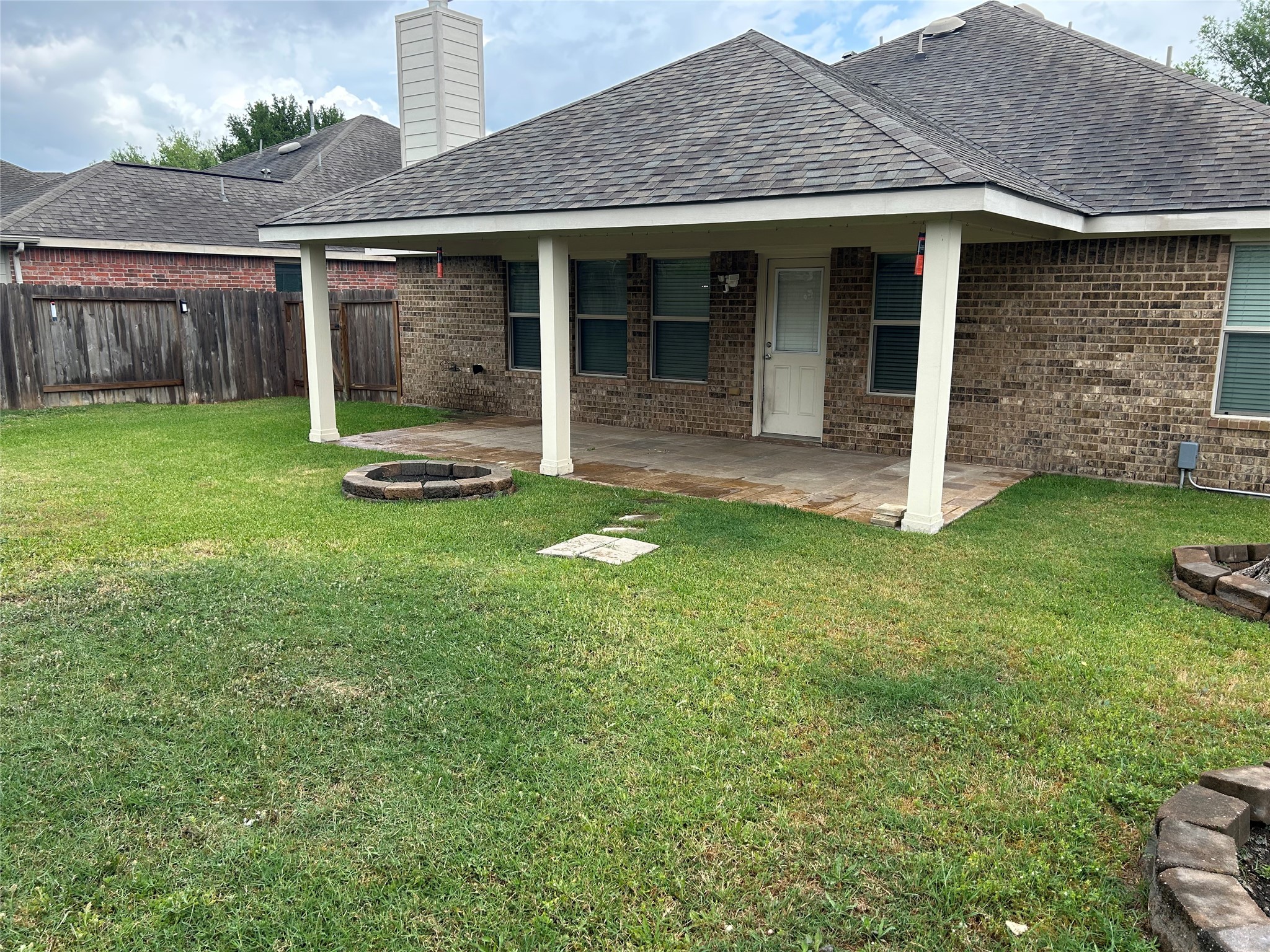 25111 Country Gate Drive Tomball, TX 77375 - Photo 21 of 22 front view of a brick house with a yard
