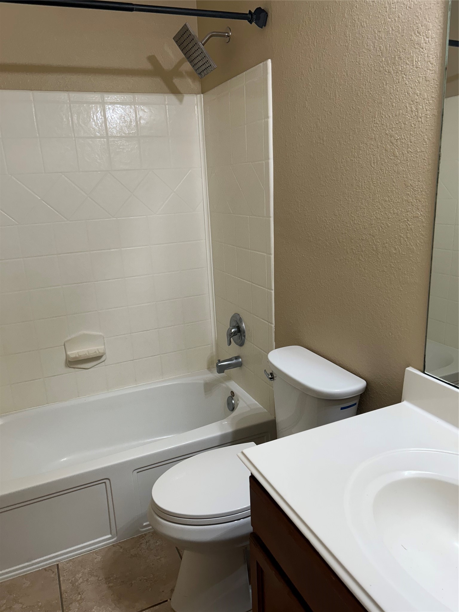 25111 Country Gate Drive Tomball, TX 77375 - Photo 5 of 22 a white toilet sitting next to a bathroom sink and vanity