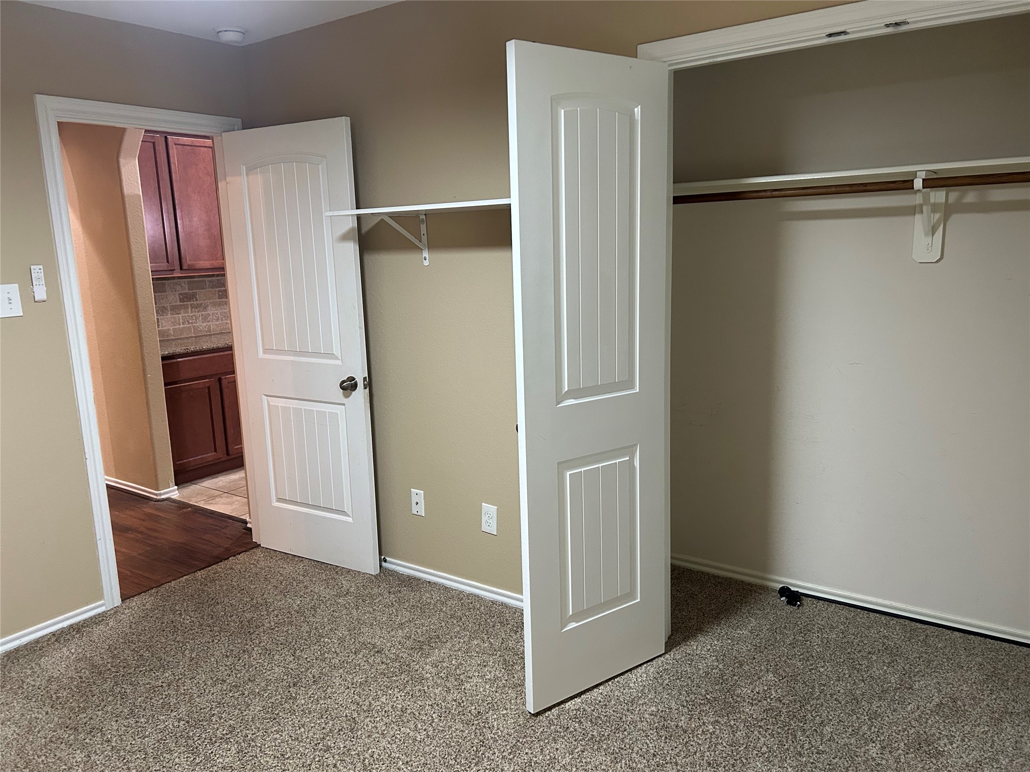 25111 Country Gate Drive Tomball, TX 77375 - Photo 10 of 22 an empty room with closet and a fireplace