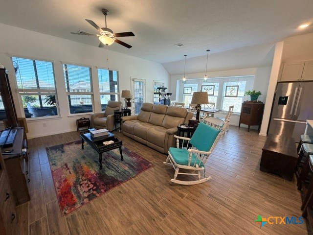 8942 Rancher Place Seguin, TX 78155 - Photo 12 of 48 a living room with furniture large window and wooden floor