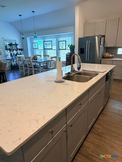 8942 Rancher Place Seguin, TX 78155 - Photo 18 of 48 a kitchen with stainless steel appliances a dining table and chairs