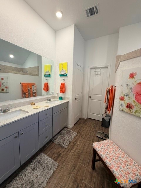 8942 Rancher Place Seguin, TX 78155 - Photo 28 of 48 a kitchen with a sink and wooden floor