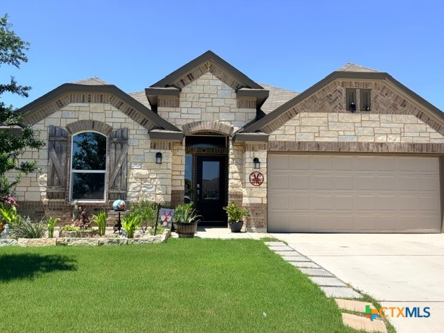 8942 Rancher Place Seguin, TX 78155 - Photo 3 of 48 a front view of a house with a yard