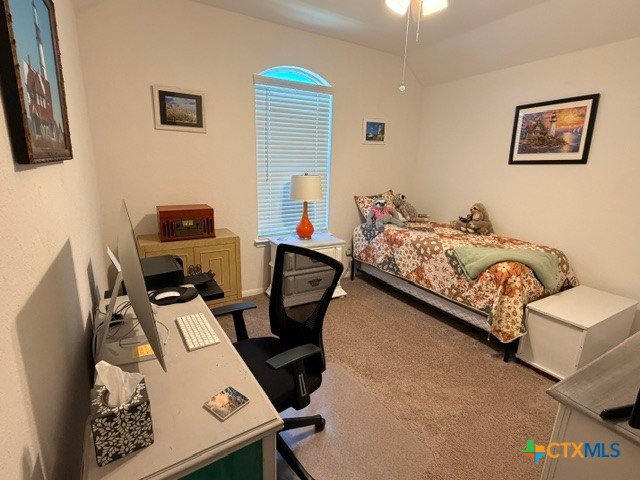8942 Rancher Place Seguin, TX 78155 - Photo 33 of 48 a bedroom with bed and a desk