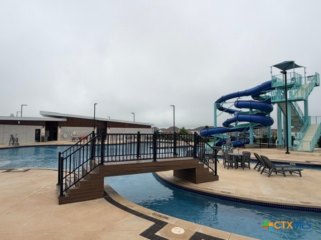 8942 Rancher Place Seguin, TX 78155 - Photo 45 of 48 a view of a swimming pool with furniture