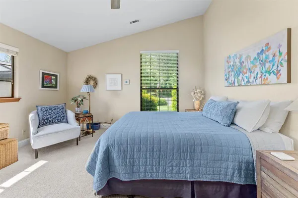 a bedroom with a bed and a couch