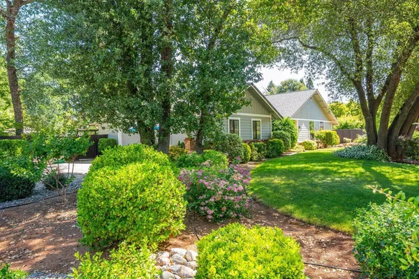 a view of backyard of a house