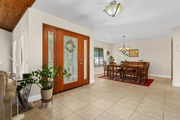 a bed room with furniture and potted plant