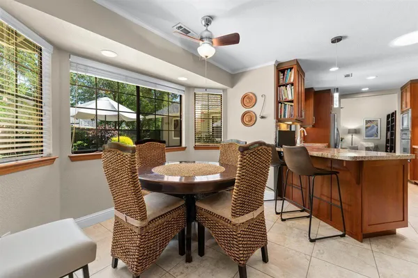 a view of a dining room with furniture window and outside view