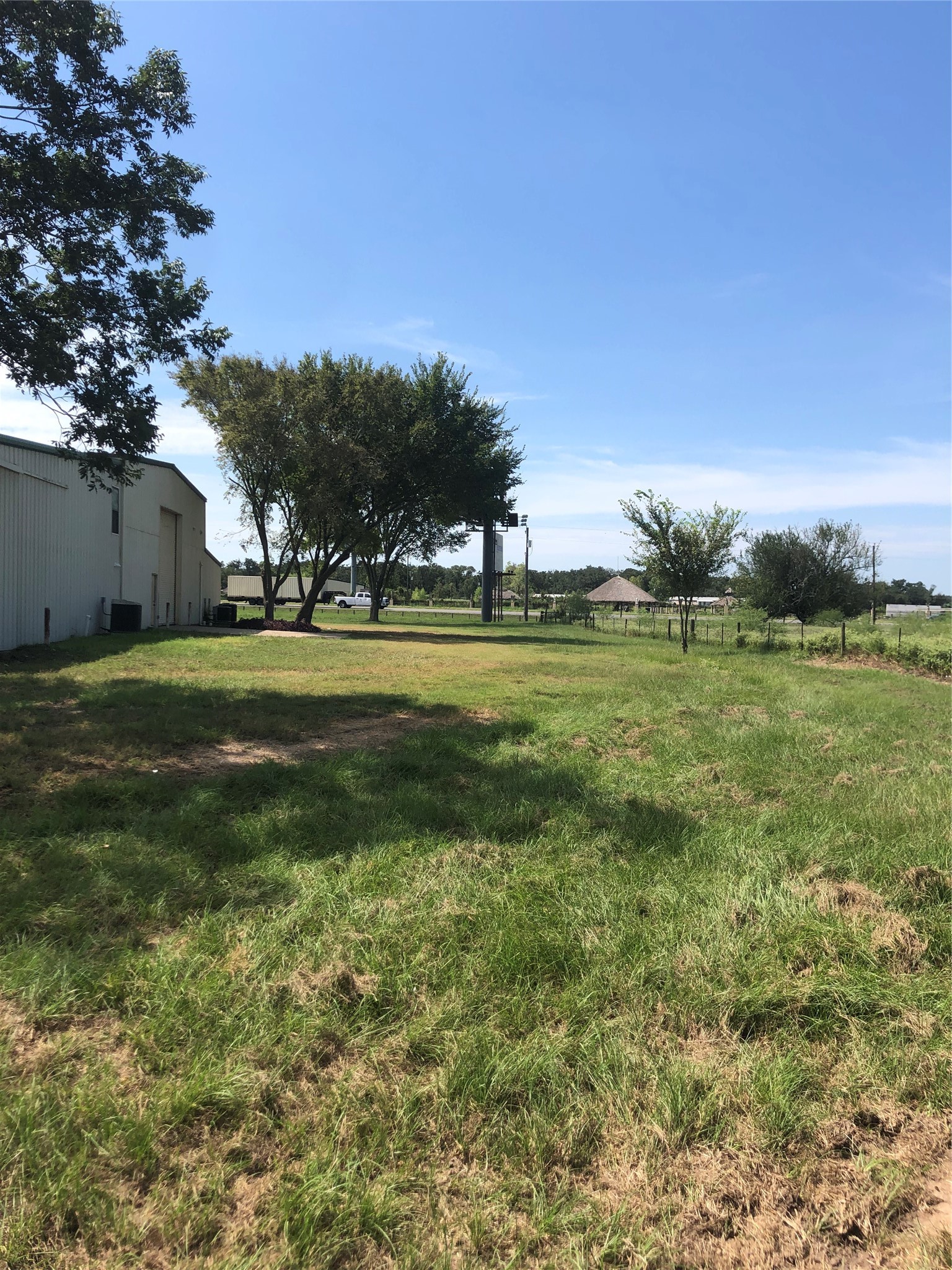 54012 Highway 290 East Hempstead, TX 77445 - Photo 17 of 21 a view of a green field with trees in the background