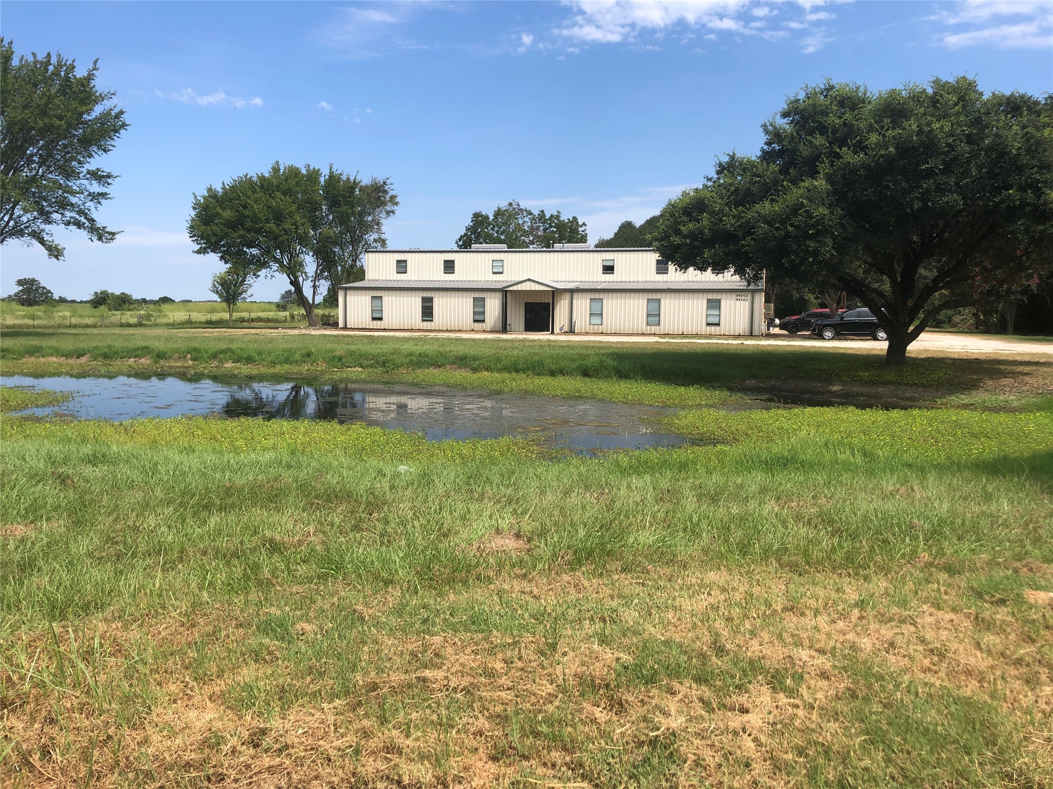 54012 Highway 290 East Hempstead, TX 77445 - Photo 19 of 21 a front view of a house with a garden