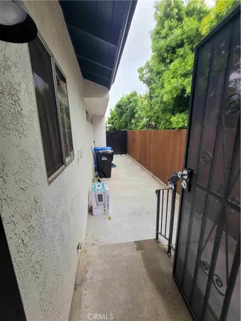 a view of balcony with furniture