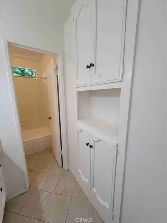 a bathroom with a tub and a shower