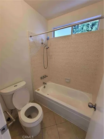 a bathroom with a sink a toilet and a bathtub