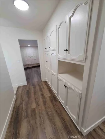 a view of a hallway with white walls