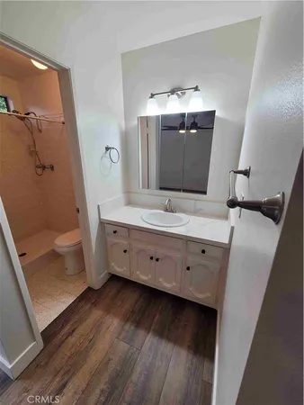 a bathroom with a double vanity sink and mirror