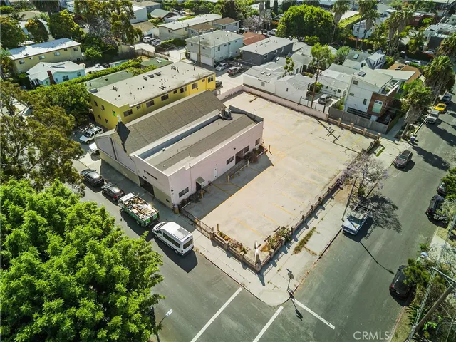 an aerial view of a residential houses with outdoor space