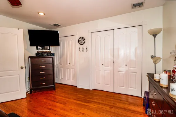 a bathroom with a toilet and a shower curtain