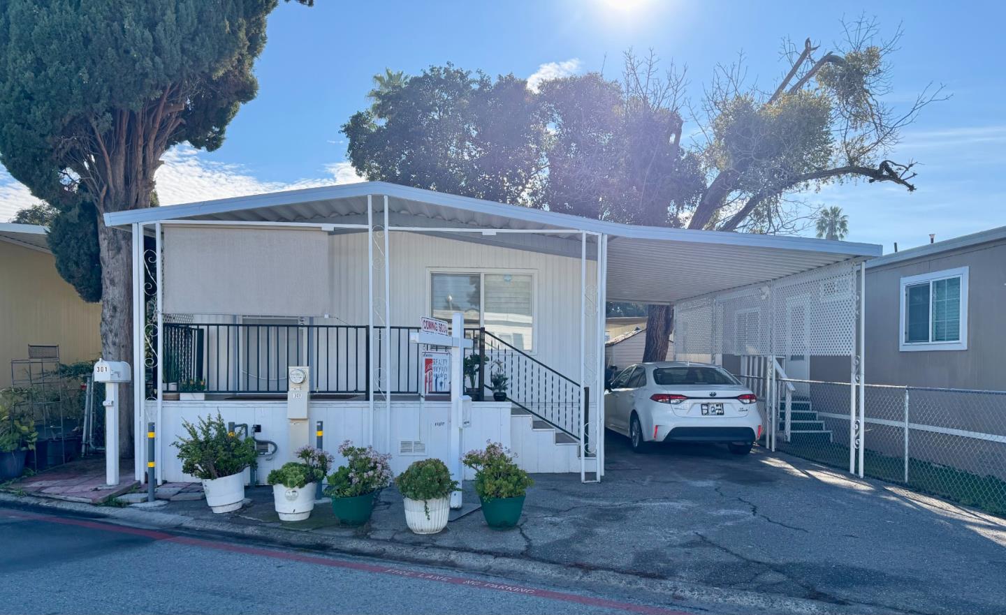 a view of a house with a porch and furniture