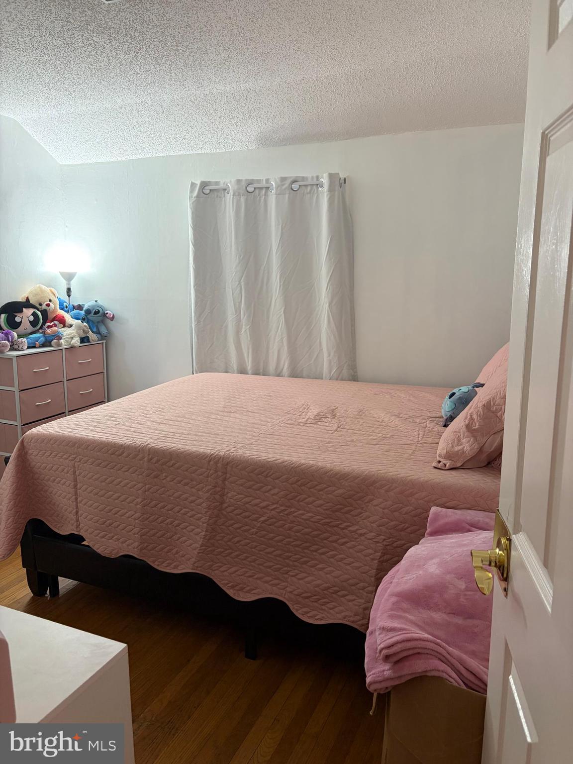 7404 Wyndam Road Pennsauken, NJ 08110 - Photo 29 of 50 a bedroom with a bed and wooden floor