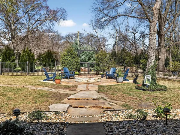 a view of a yard with swimming pool