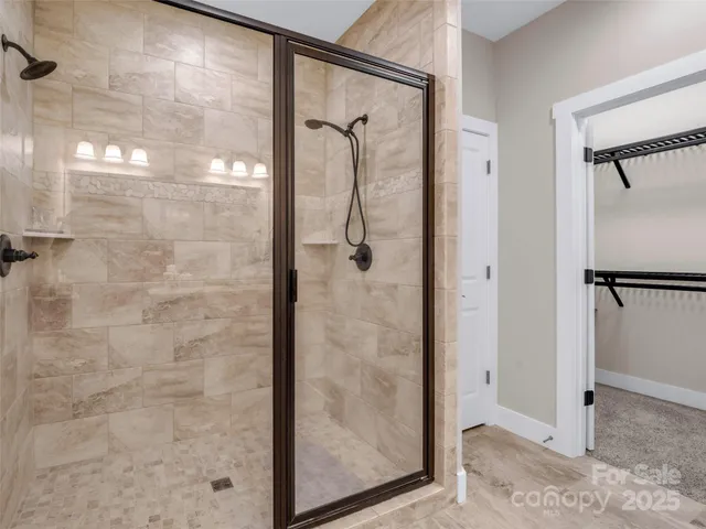 a bathroom with a glass shower door