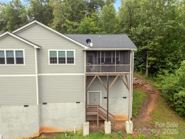 a aerial view of a house next to a yard