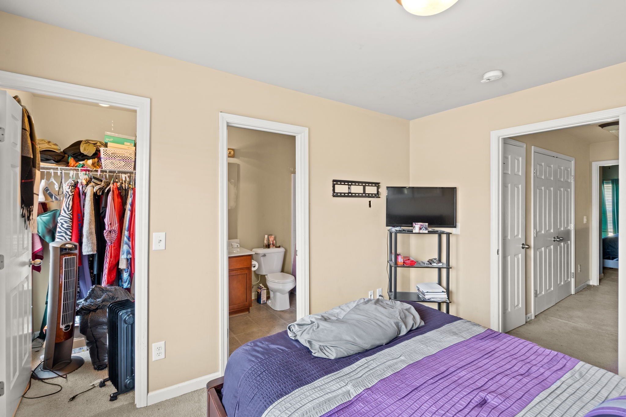 1382 Rural Hill Road, Unit 103 Antioch, TN 37013 - Photo 11 of 15 a bedroom with a bed and a flat tv screen