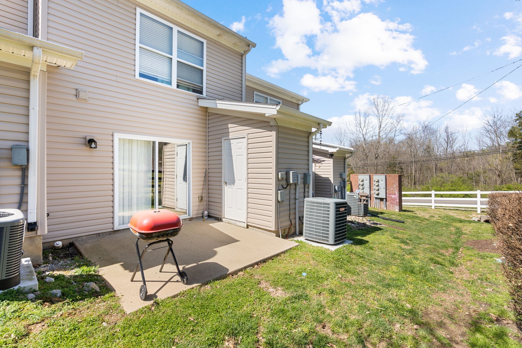 1382 Rural Hill Road, Unit 103 Antioch, TN 37013 - Photo 15 of 15 a view of a backyard with a table and chairs and a large tree