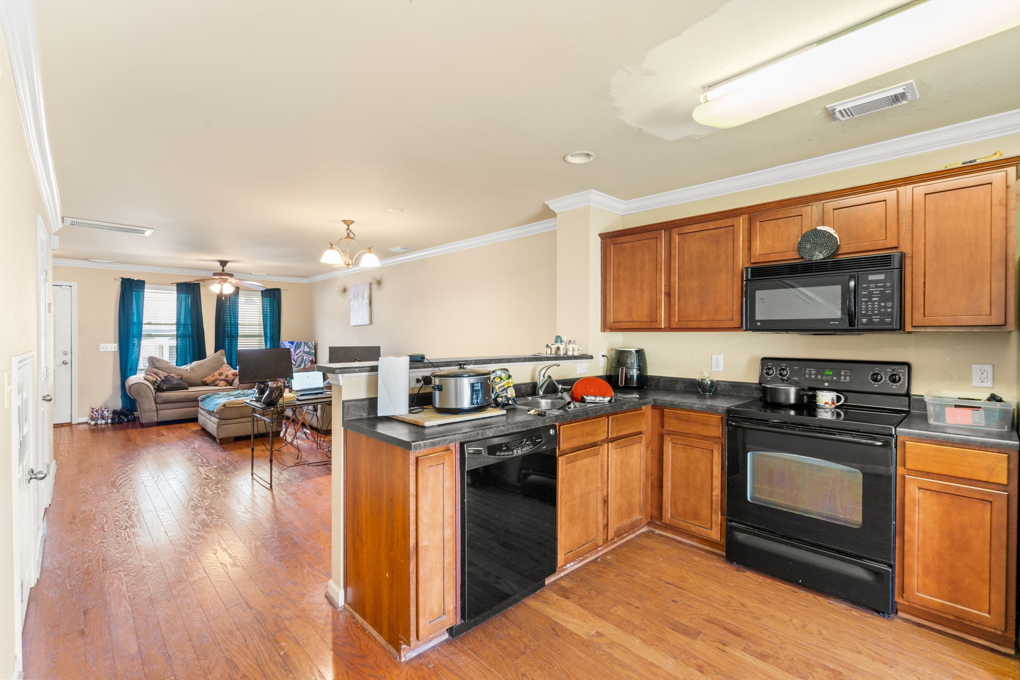 1382 Rural Hill Road, Unit 103 Antioch, TN 37013 - Photo 9 of 15 a kitchen with lots of counter top space and a wooden floor