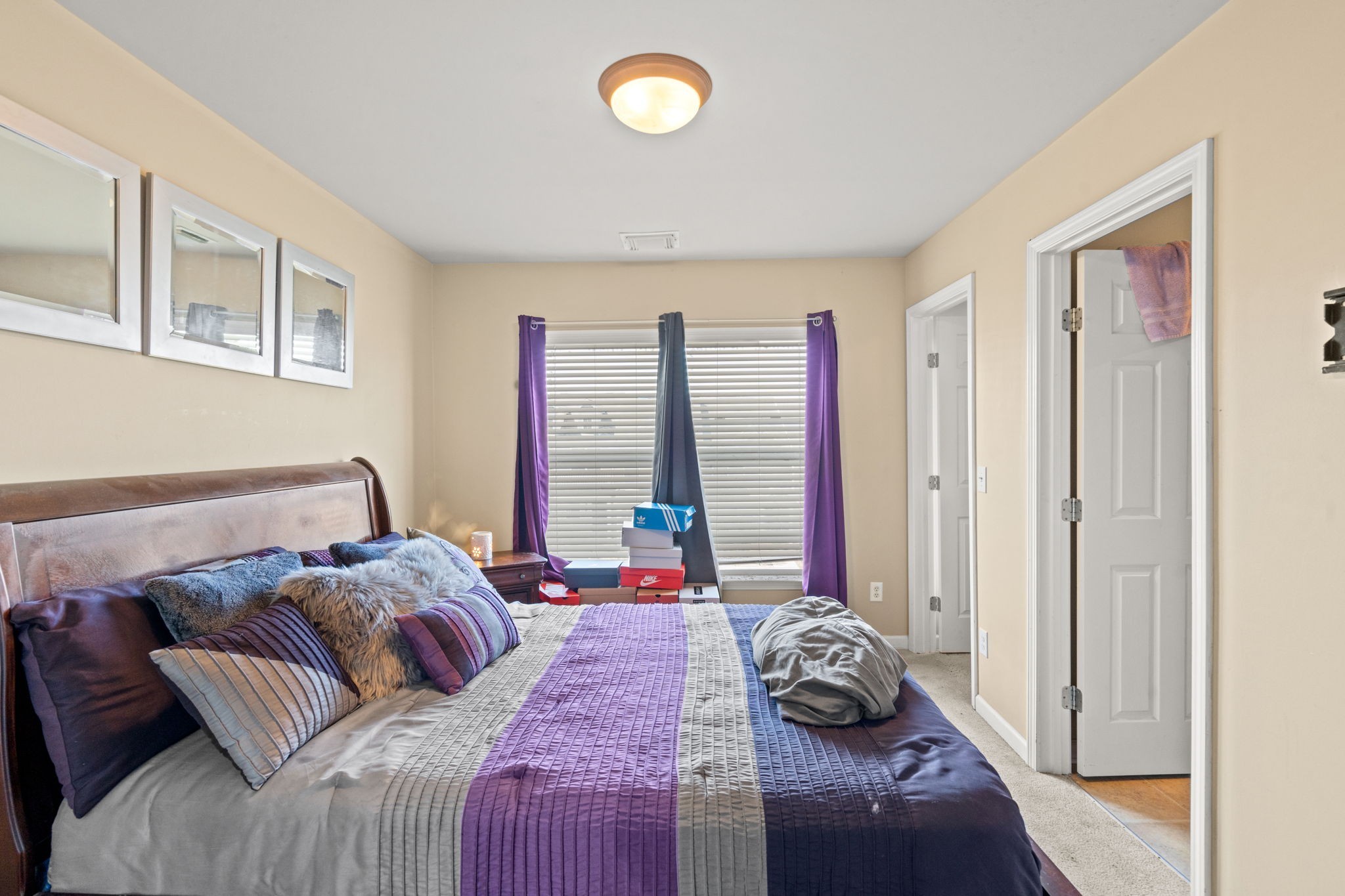 1382 Rural Hill Road, Unit 103 Antioch, TN 37013 - Photo 10 of 15 a bedroom with a bed and a window