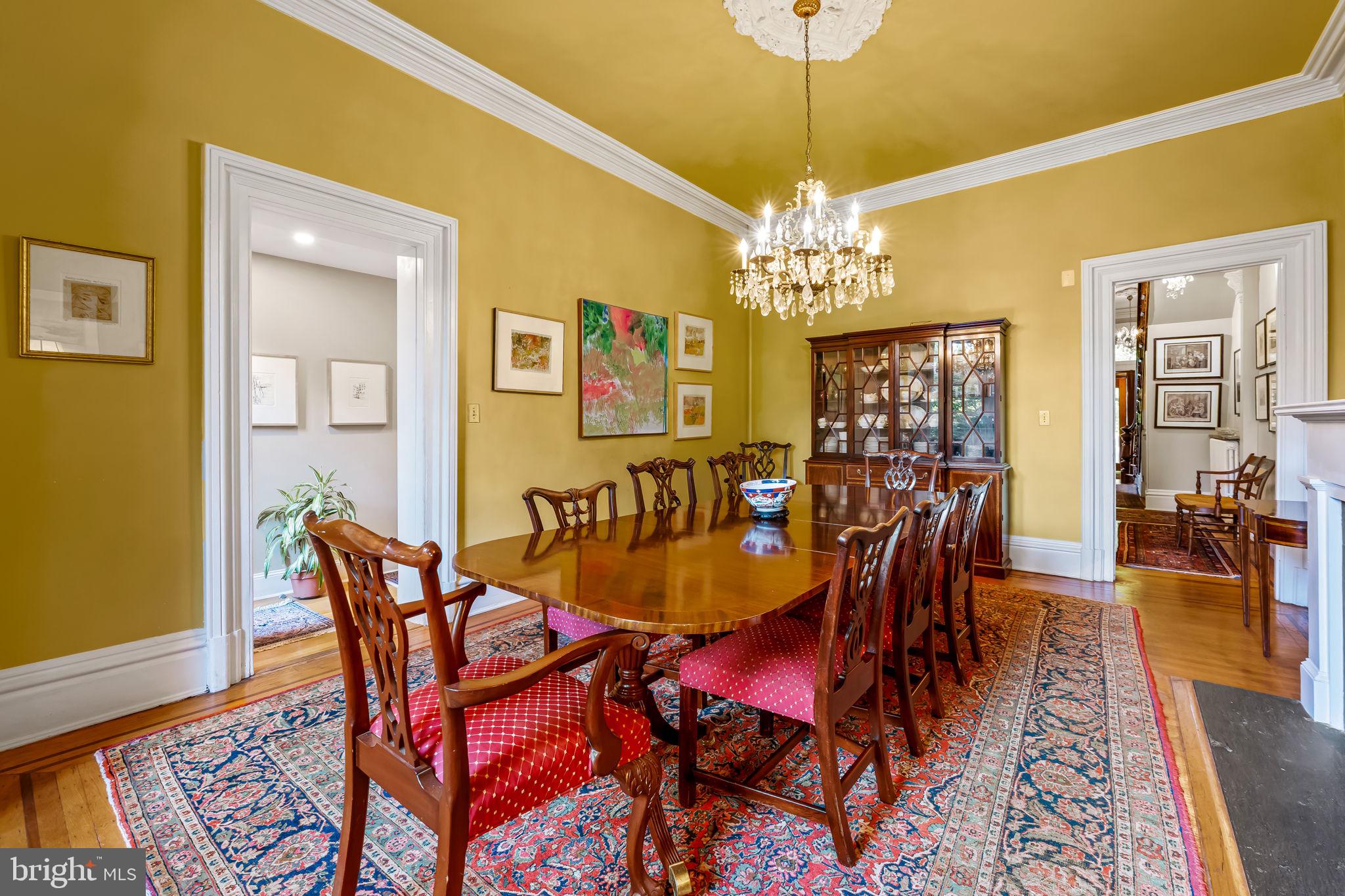 1310 Bolton Street Baltimore, MD 21217 - Photo 21 of 69 a dining room with furniture and chandelier