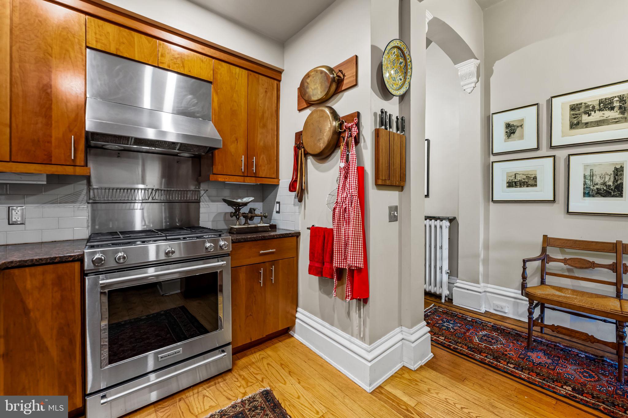 1310 Bolton Street Baltimore, MD 21217 - Photo 25 of 69 a kitchen with a stove and a cabinet