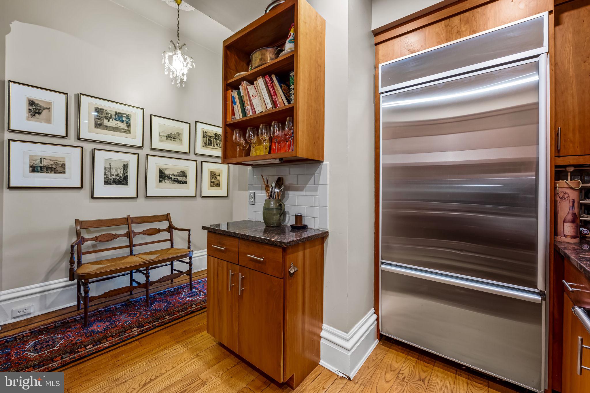 1310 Bolton Street Baltimore, MD 21217 - Photo 26 of 69 a kitchen with stainless steel appliances granite countertop a refrigerator and a stove