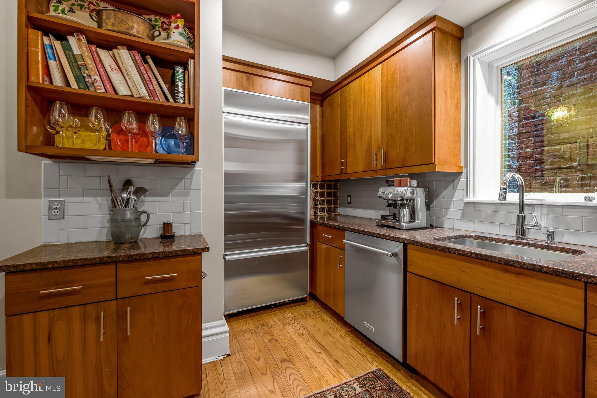 1310 Bolton Street Baltimore, MD 21217 - Photo 27 of 69 a kitchen with stainless steel appliances granite countertop a refrigerator and a sink