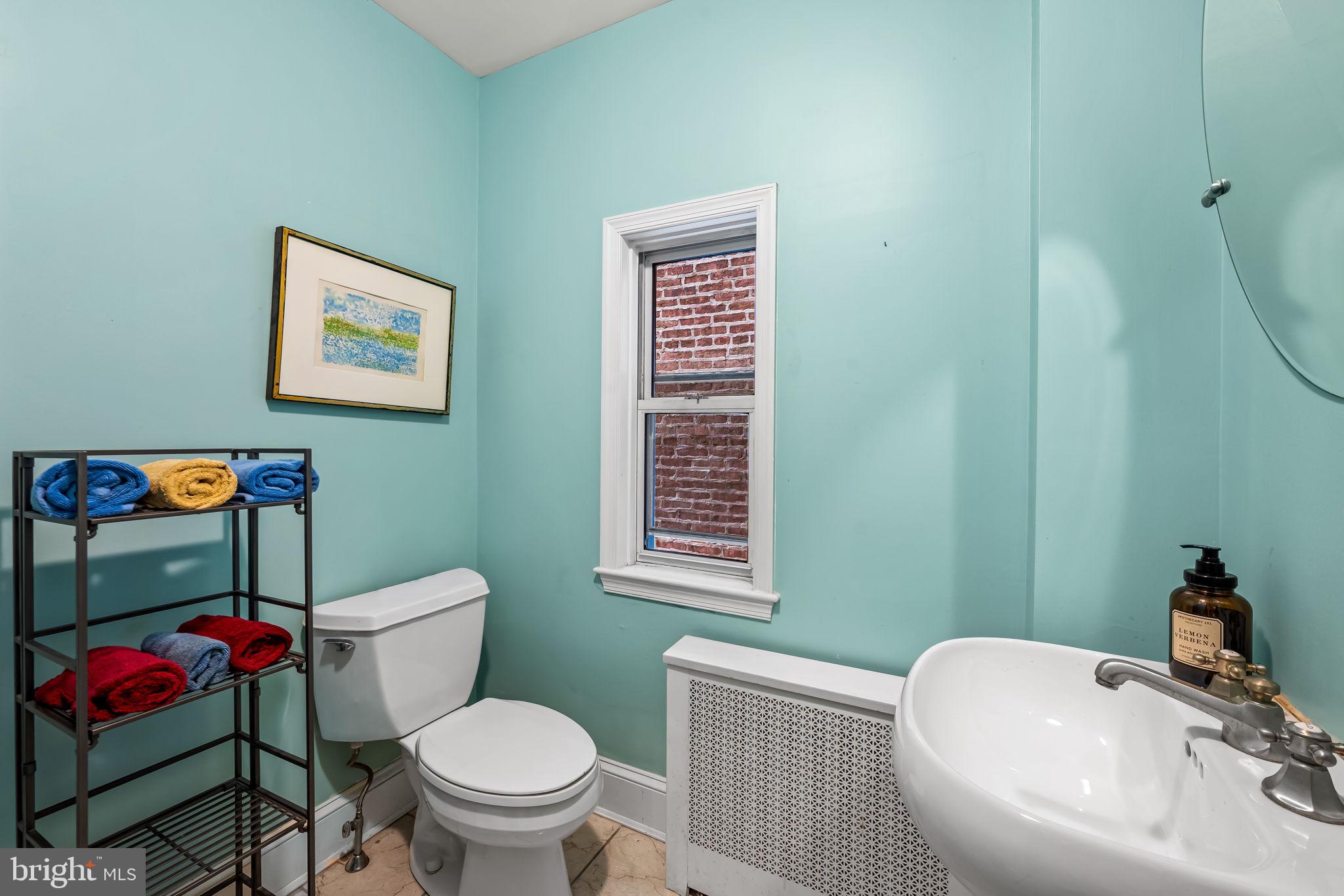 1310 Bolton Street Baltimore, MD 21217 - Photo 37 of 69 a bathroom with a toilet sink and tub