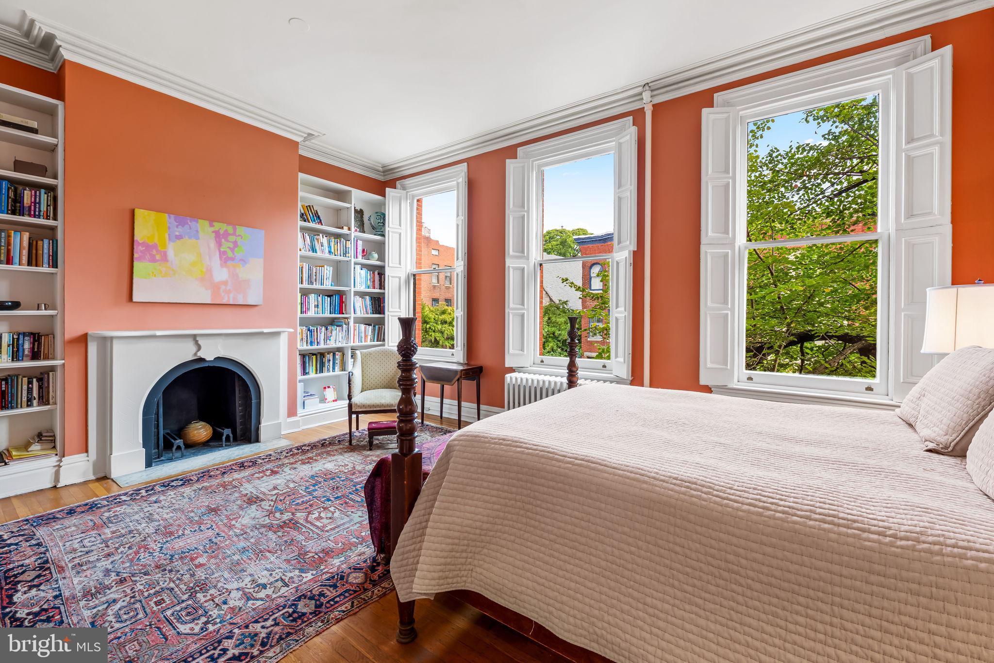 1310 Bolton Street Baltimore, MD 21217 - Photo 41 of 69 a spacious bedroom with a bed and a fireplace