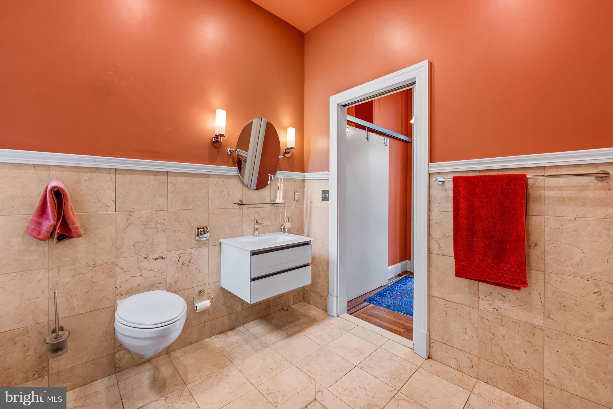 1310 Bolton Street Baltimore, MD 21217 - Photo 44 of 69 a bathroom with a toilet and a shower