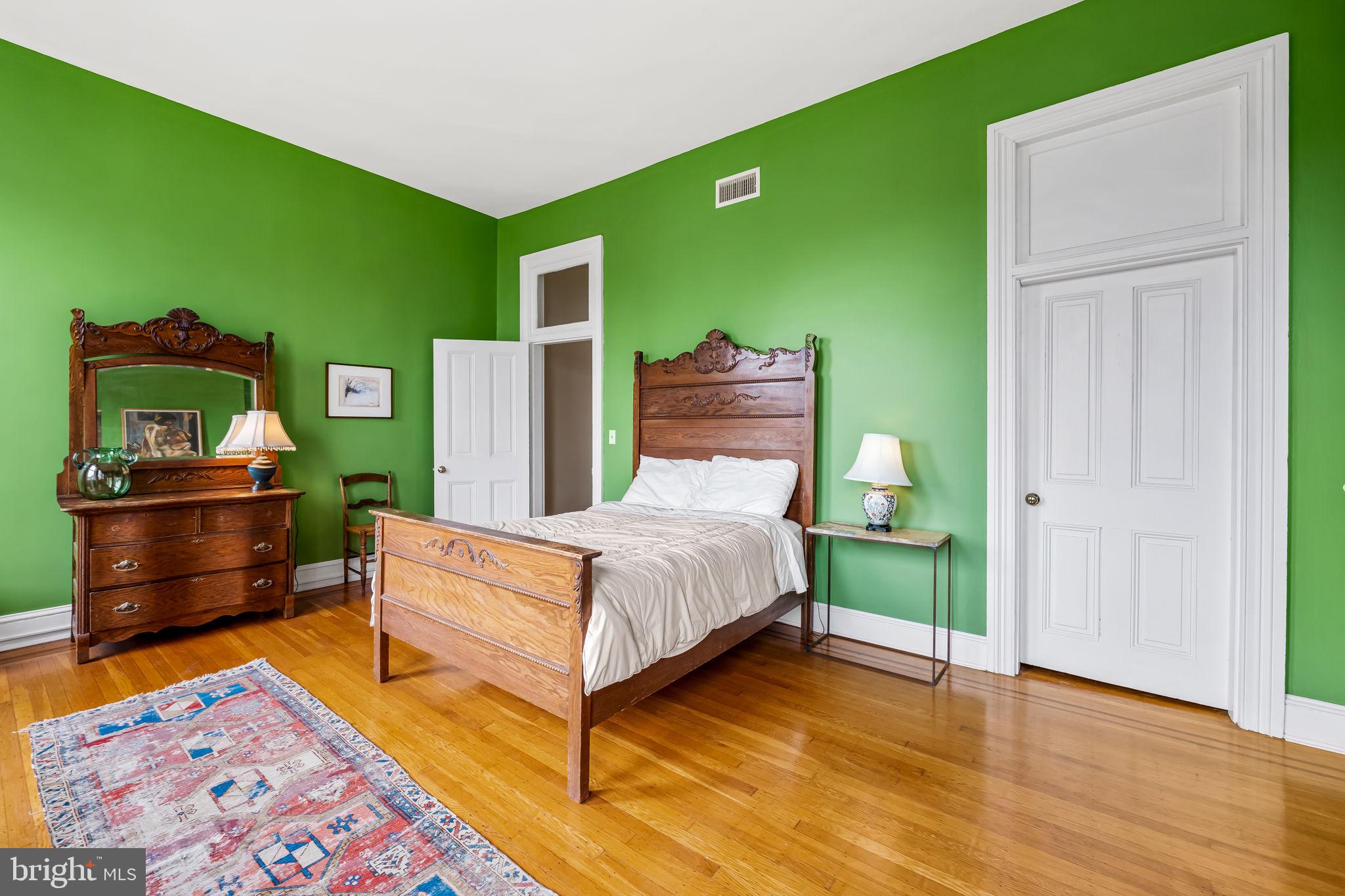 1310 Bolton Street Baltimore, MD 21217 - Photo 48 of 69 a bedroom with a bed and a dresser