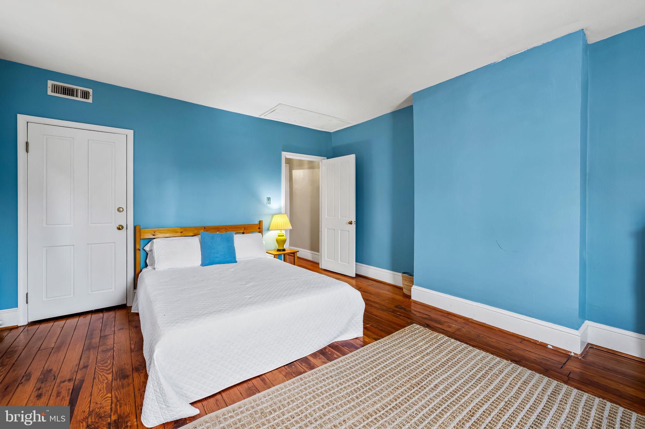 1310 Bolton Street Baltimore, MD 21217 - Photo 52 of 69 a bedroom with two beds and wooden floor