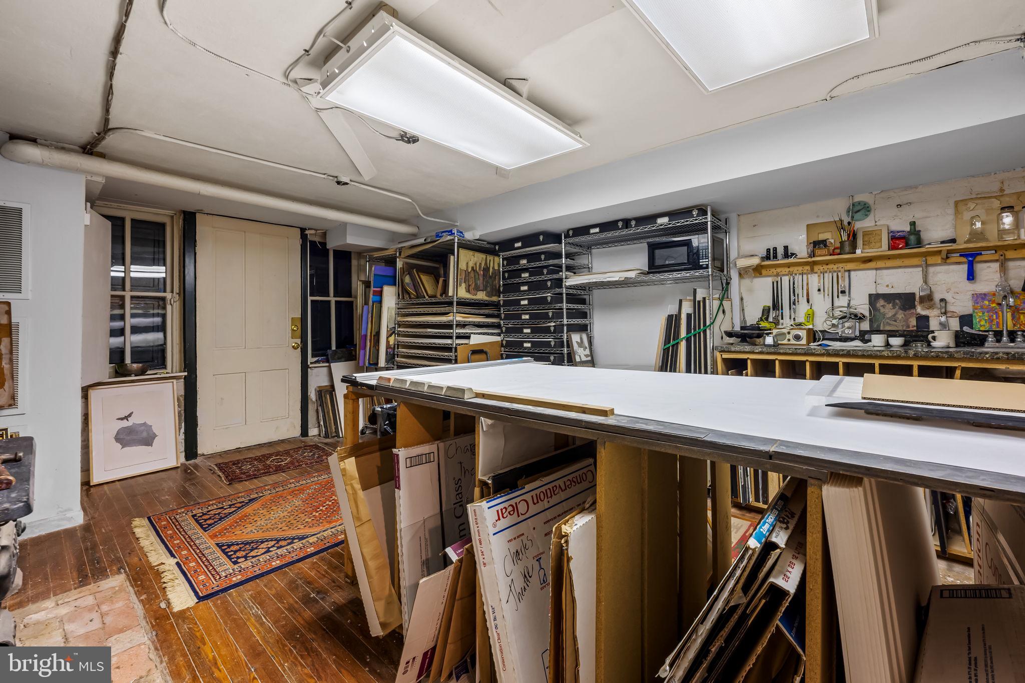 1310 Bolton Street Baltimore, MD 21217 - Photo 54 of 69 a kitchen with stainless steel appliances granite countertop a refrigerator and a stove top oven