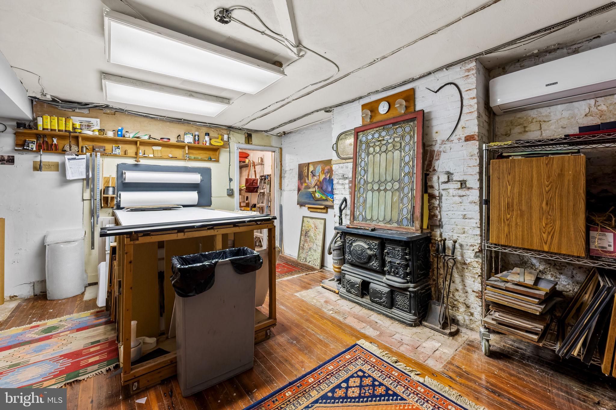 1310 Bolton Street Baltimore, MD 21217 - Photo 55 of 69 a kitchen with stainless steel appliances granite countertop a stove and a refrigerator