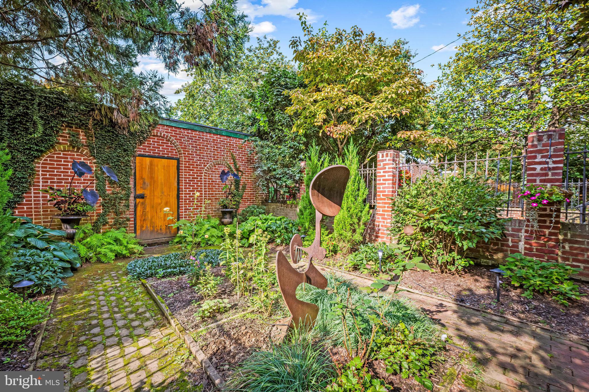 1310 Bolton Street Baltimore, MD 21217 - Photo 58 of 69 a backyard of a house with a yard and outdoor seating