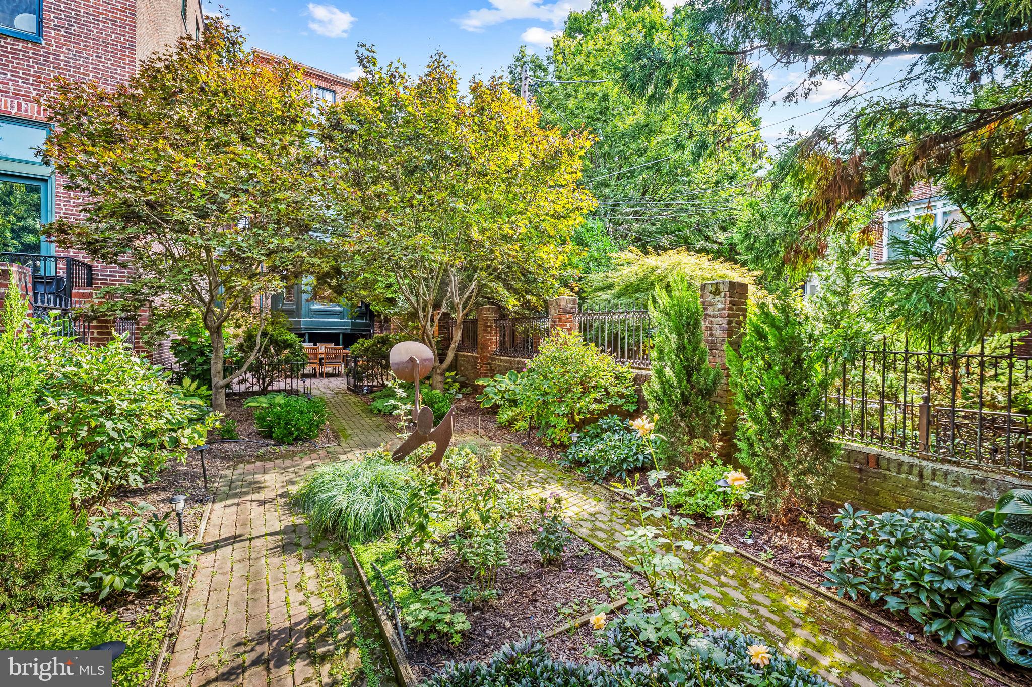 1310 Bolton Street Baltimore, MD 21217 - Photo 59 of 69 a backyard of a house with lots of green space and garden view