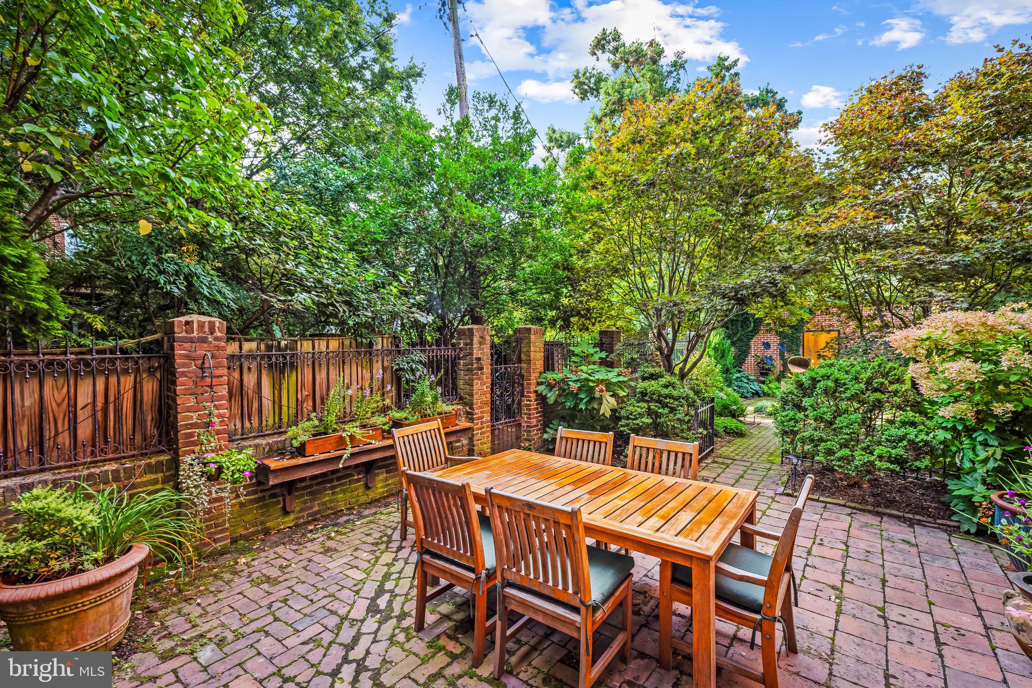 1310 Bolton Street Baltimore, MD 21217 - Photo 61 of 69 a backyard of a house with table and chairs