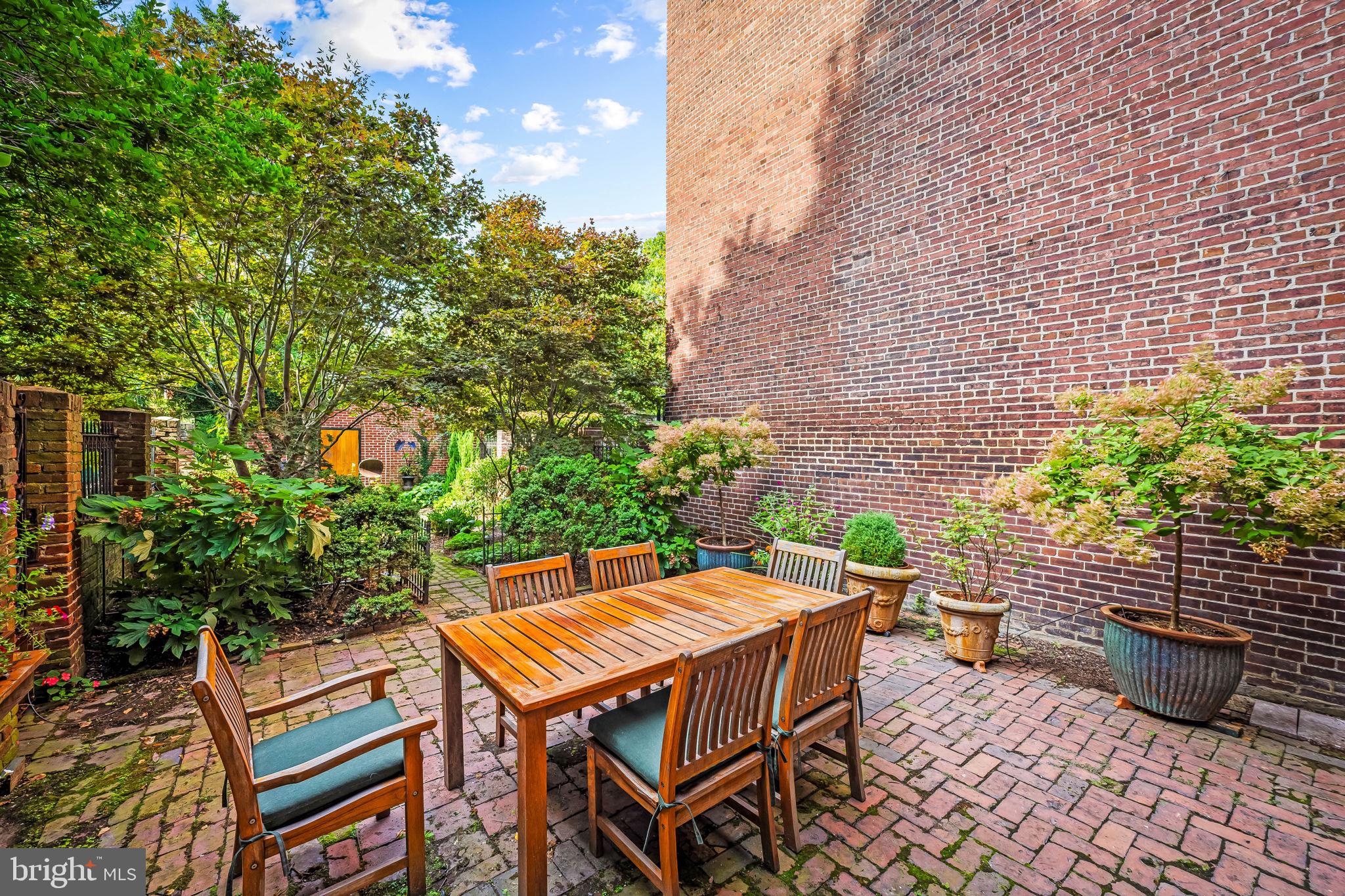1310 Bolton Street Baltimore, MD 21217 - Photo 62 of 69 a backyard of a house with table and chairs