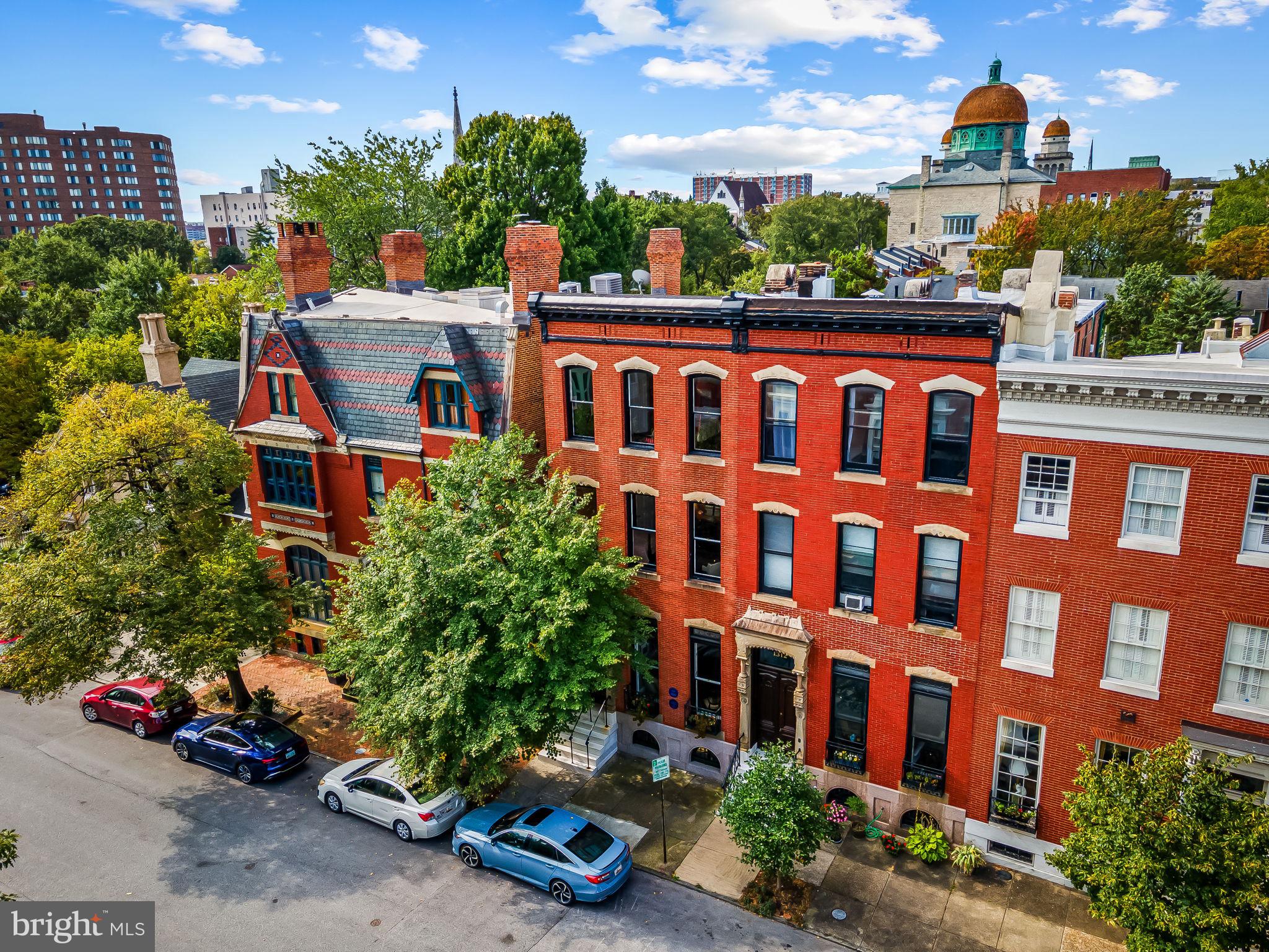 1310 Bolton Street Baltimore, MD 21217 - Photo 65 of 69 front view of a building with potted plants