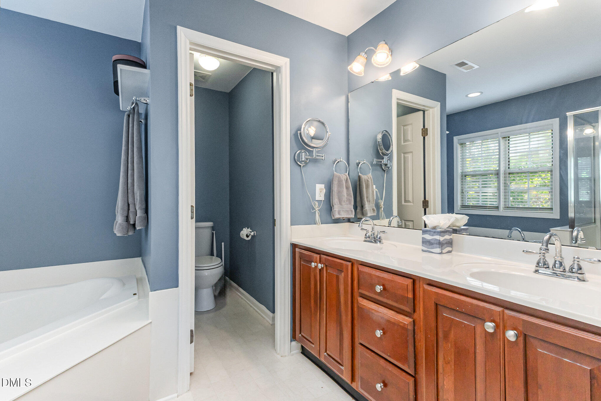 102 Higher Learning Drive Durham, NC 27713 - Photo 15 of 28 a spacious bathroom with a double vanity sink mirror and bathtub