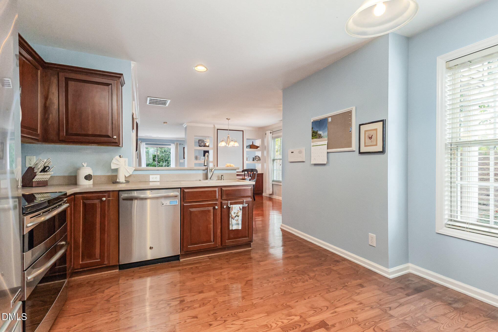 102 Higher Learning Drive Durham, NC 27713 - Photo 10 of 28 a kitchen with stainless steel appliances granite countertop a stove and a sink